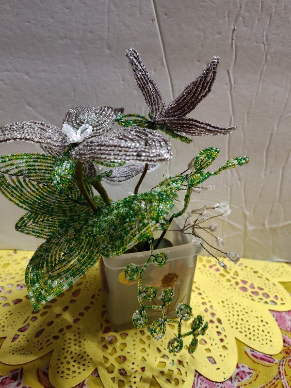 Flower Hand Beaded On Wire. Lavender and White . Green Leaves. Apx. 6" X 6".