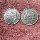 MORGAN SILVER DOLLAR COINS.  LOT OF 2  AU. DETAILS  PRE. 1921  LOT # 42