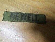 MILITARY PATCH OLDER COMBAT USED NAME TAPE SEW ON SUBDUED WITH NAME NEWELL
