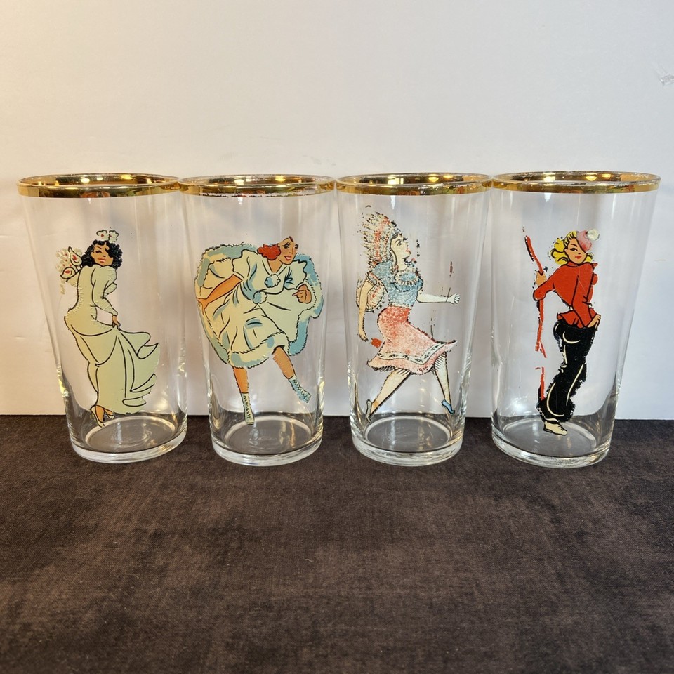 Set of four Art Deco 'Peek-a-Boo' glasses with hidden risqué imagery that reveals itself when held to light — a lost drinking tradition that's both vintage and delightfully cheeky.