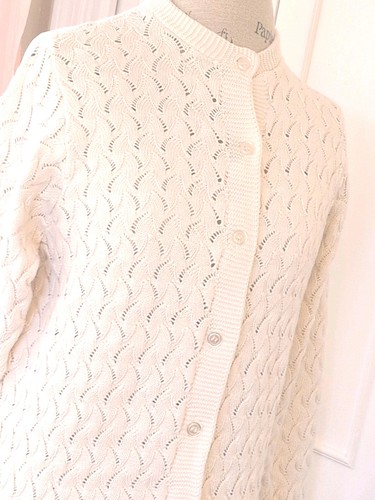 Cream knit women's long sleeve sweater with scalloped lace pattern, button front, and two front pockets made in USA.