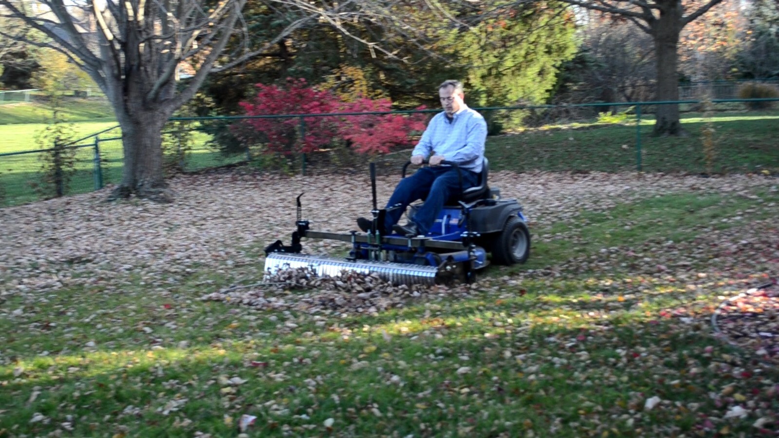 Swinging Tool Bar and Rake Ezra Lawn Care Equipment mounts on a zero