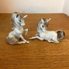 Vintage pair of ceramic Unicoen figuriens