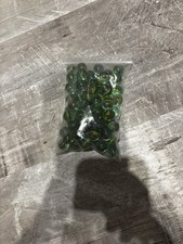 The items in the image are vintage-style glass marbles. 70 Marbles
