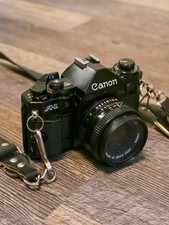 TESTED Canon A-1 35mm Film Camera FD 50mm f/1.8 Lens Skylight Filter  Battery