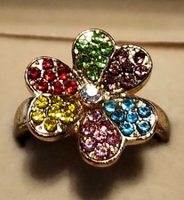 gold-toned, flower-shaped adjustable statement ring with multicolored rhinestone