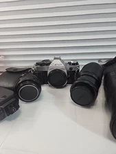 CanonAE-135mm SLR Film Camera with 50 mm lens Kit+ Flash, Needs Fixed+200mm lens