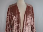 Rose gold pink velvet cover up jacket with long sleeves and open front displayed on a mannequin.