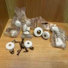 Assortment Of Ceramic White Cabinet Knobs And Assorted Screws