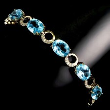 Blautopas Swiss Blue 9x7 mm Armband 925 Silber 585 Gelbgold vergoldet