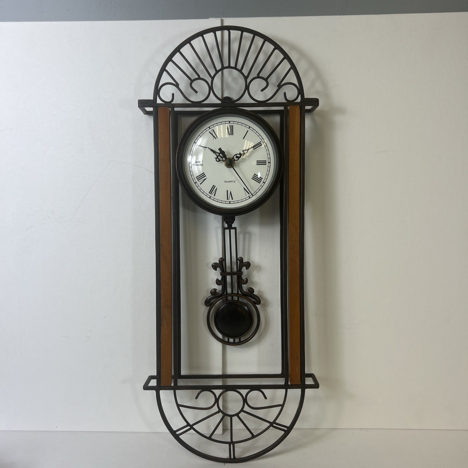 Howard Miller Devahn Wall Clock with Pendulum Antique Bronze Finish # 625 241 photo