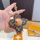 Louis Vuitton Women's Black Leather Sunflower Charm Keychain — photo 1