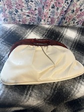 1970s clutch bag with caramel lucite handle and lifting clasp
