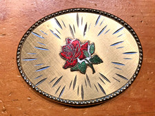 CLASSIC GOLD TONE BELT BUCKLE WITH A RED ROSE IN THE CENTER