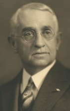 GRAY HAIRED MAN WITH WIRE RIMMED GLASSES. 8 X 10 TONED SILVER PRINT.