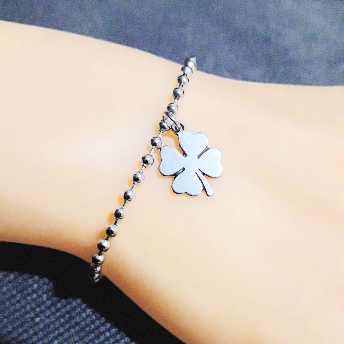 Bracciale acciaio con ciondoli quadrifoglio e coccinella sagapo