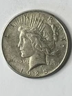 1925 SILVER PEACE DOLLAR IN GOOD TO VERY GOOD CONDITION