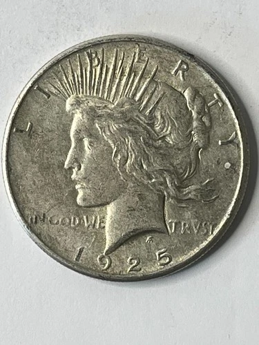 1925 SILVER PEACE DOLLAR IN GOOD TO VERY GOOD CONDITION