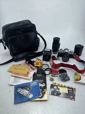 AV-1 Canon 35mm camera, telephoto lens, flash attachment, case