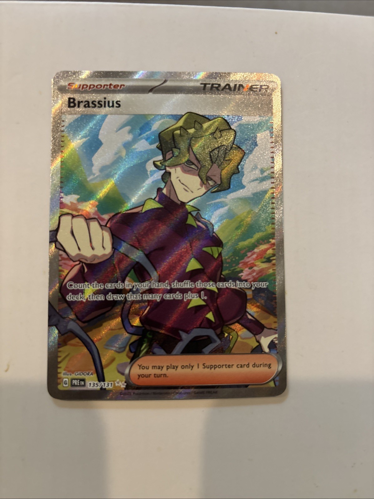 Pokémon TCG Brassius Full Art Trainer Ultra Rare Prismatic Evolution LP #135/131