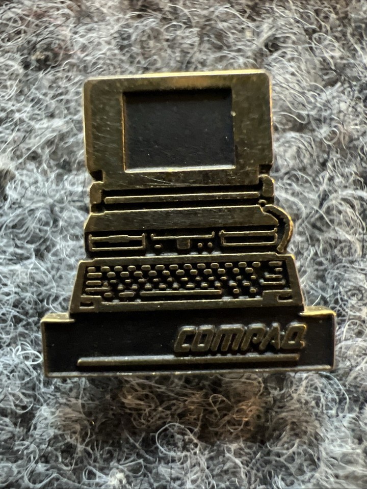 An authentic Compaq employee pinback from the era when Compaq was THE PC giant — wearable tech nostalgia that fits in your pocket.
