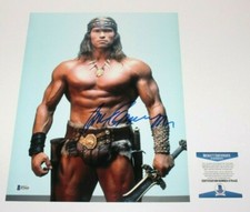 ARNOLD SCHWARZENEGGER SIGNED CONAN THE BARBARIAN 11x14 MOVIE PHOTO BECKETT COA