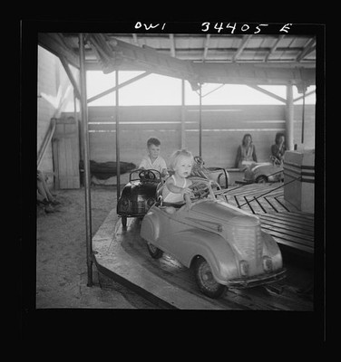 Photo:1930s Children Riding Toy Cars Carousel Amusement Ride Garage