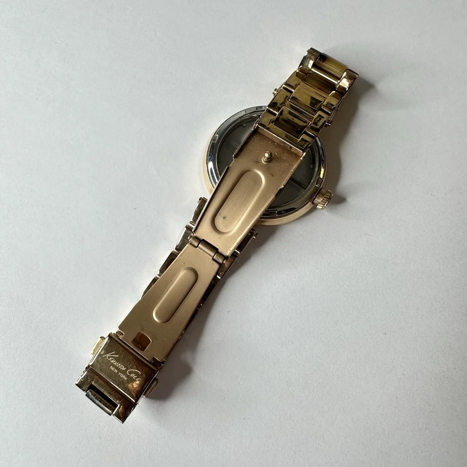 Reloj Kenneth Cole NY para mujer transparente clásico esfera transparente oro tortuga Foto 4 de 4