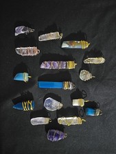 Wire Wrapped crystals Pendents Multi color Sold separately.