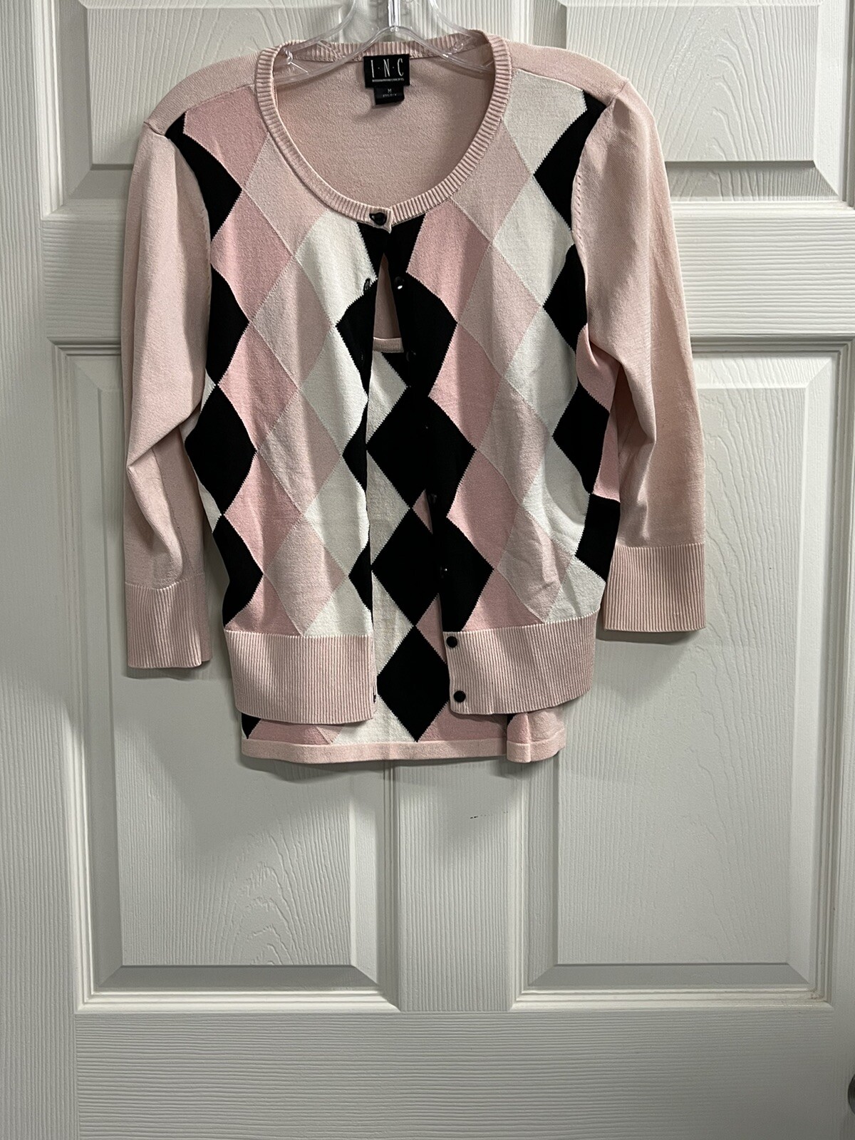 pink black and white sweater