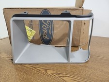 NOS 1981 FORD ESCORT LH HEADLAMP DOOR TRIM BE...