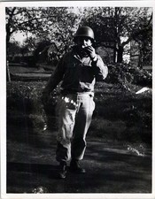 WW2 Photo of Soldier Standing in Field Eating with Helmet and Gear