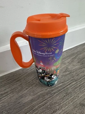 Walt Disney World Resort Refillable Travel Mug - Fireworks & Characters Orange - Image 1 of 4