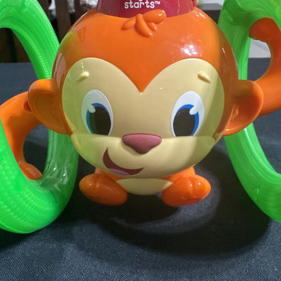 Juguete para bebé gateando mono con luces y sonidos Bright Starts Roll & Glow Foto 3 de 4