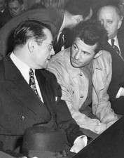 American boxer Rocky Graziano listening to his lawyer Jacob Rosenb- Old Photo
