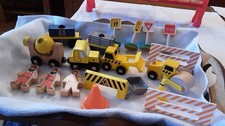 WOODEN TOYS FOR CONSTRUCTION. TO INCLUDE 4 VEHICLES AND 2WAGONS 3 PEOPLE,