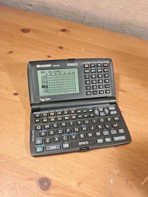 Sharp Wizard OZ-570 Personal Electronic Organizer Day-Timer PC Connection