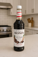 Monin Dark Chocolate Syrup 1L for hot and cold beverages. Best Before Feb 2026
