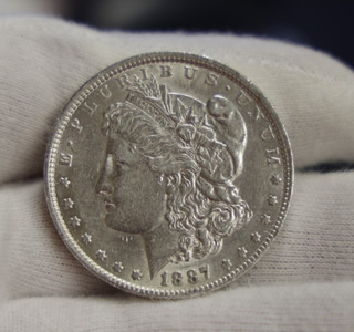 1887 O US Morgan Dollar $1 AU (Cleaned)