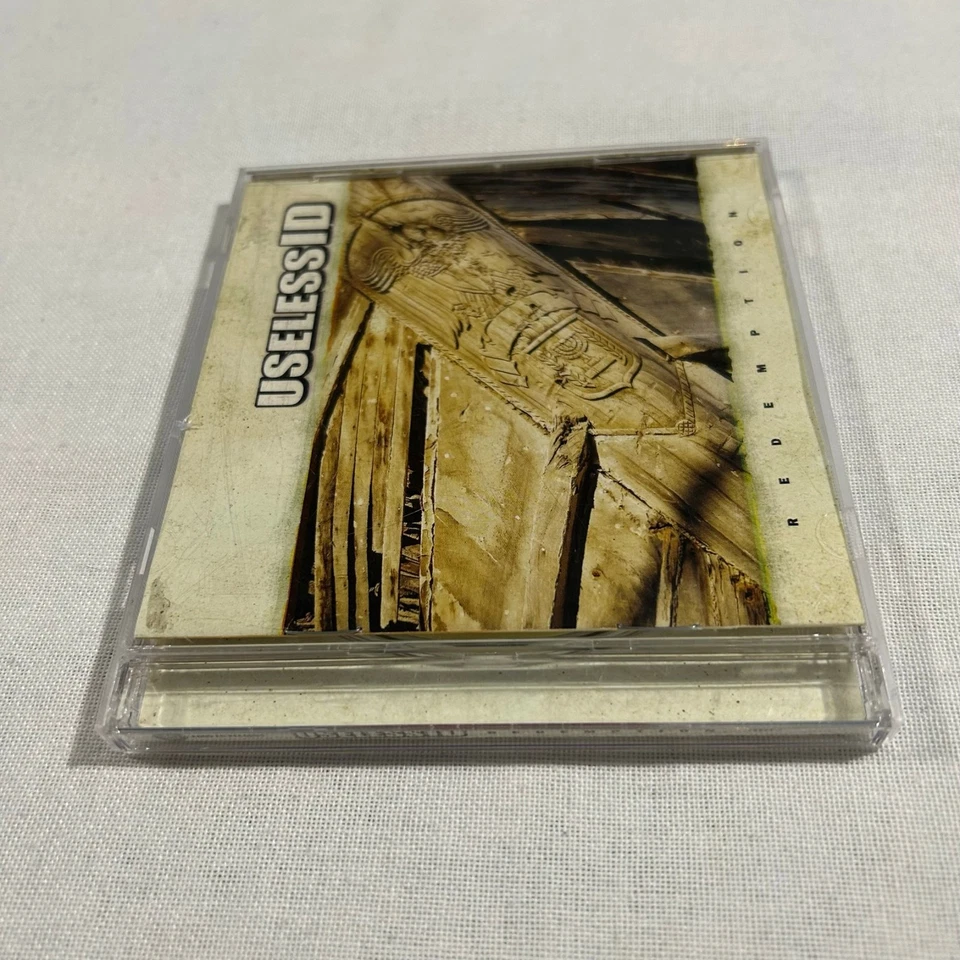 CD de canje de identificación inútil 2004 Foto 3 de 4