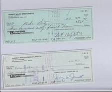 Mike Seitz and Eddie Marlin signed checks from Jerry Jarrett and Bob Wright