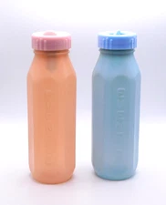 Set of 2 Vintage Baby Bottles Plastic Evenflo Peach Blue Lids 8 oz Collectible