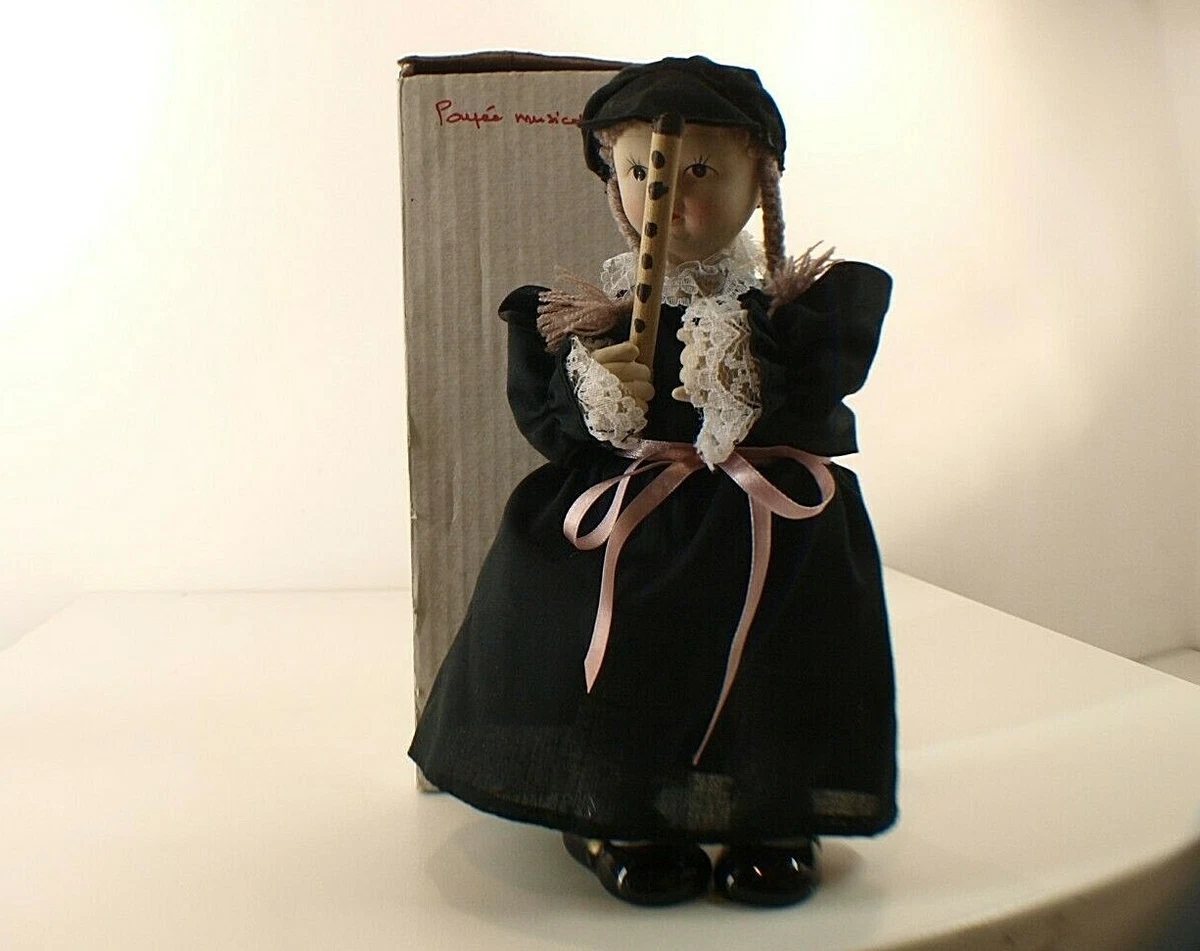 poupée musicale jeune fille avec flûte mouvement à clef porcelaine tissu 29  cm