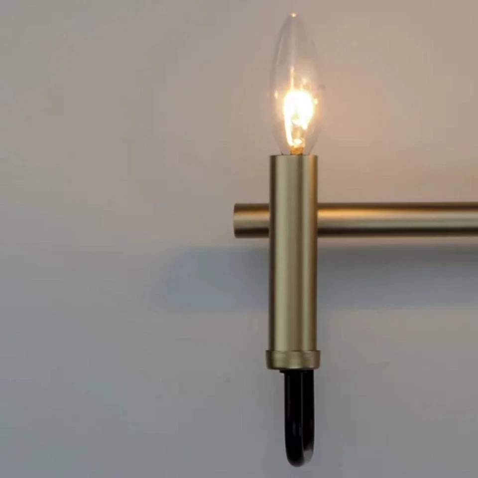 Luz de tocador Sullivan de 3 luces anchas negra/dorada de Maxim Lighting Foto 2 de 4