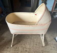 Vintage woven white and pink wicker baby bassinet  canopy, folding rolling legs