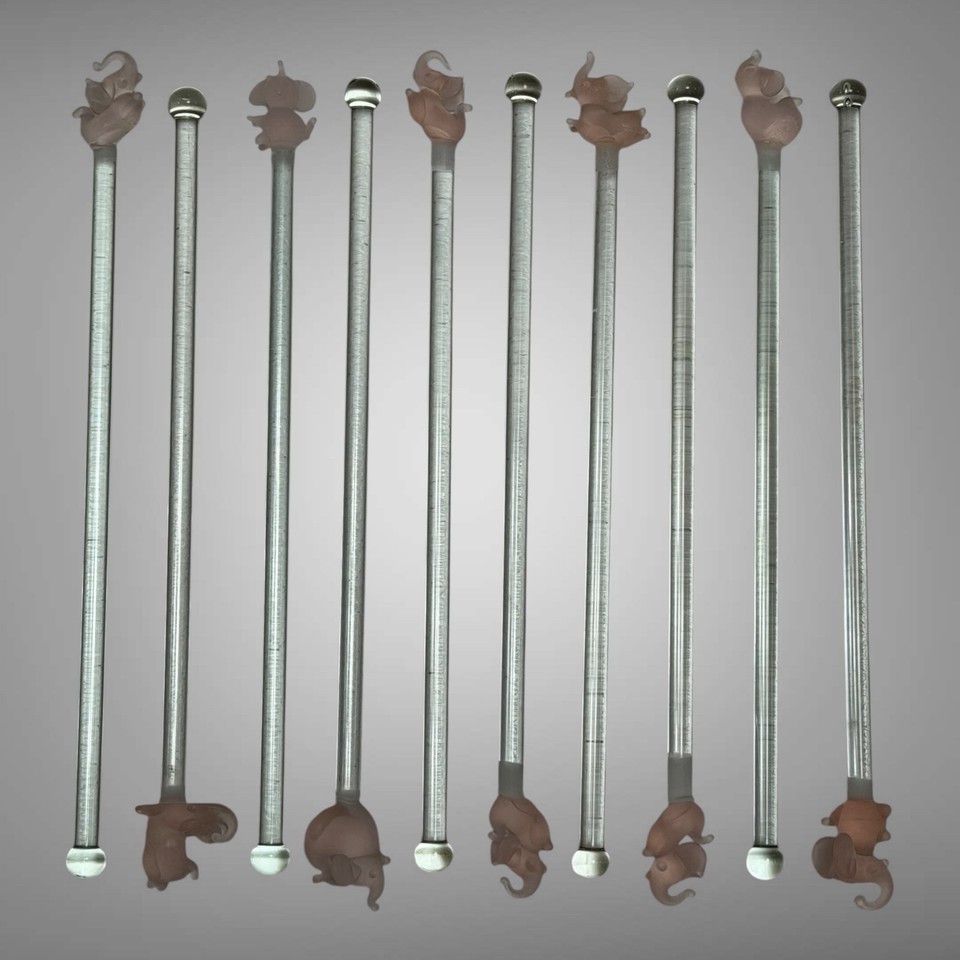 A full set of 10 frosted pink elephant swizzle sticks — more party-ready than the trio, and the pink elephant is a legitimately iconic MCM barware motif.