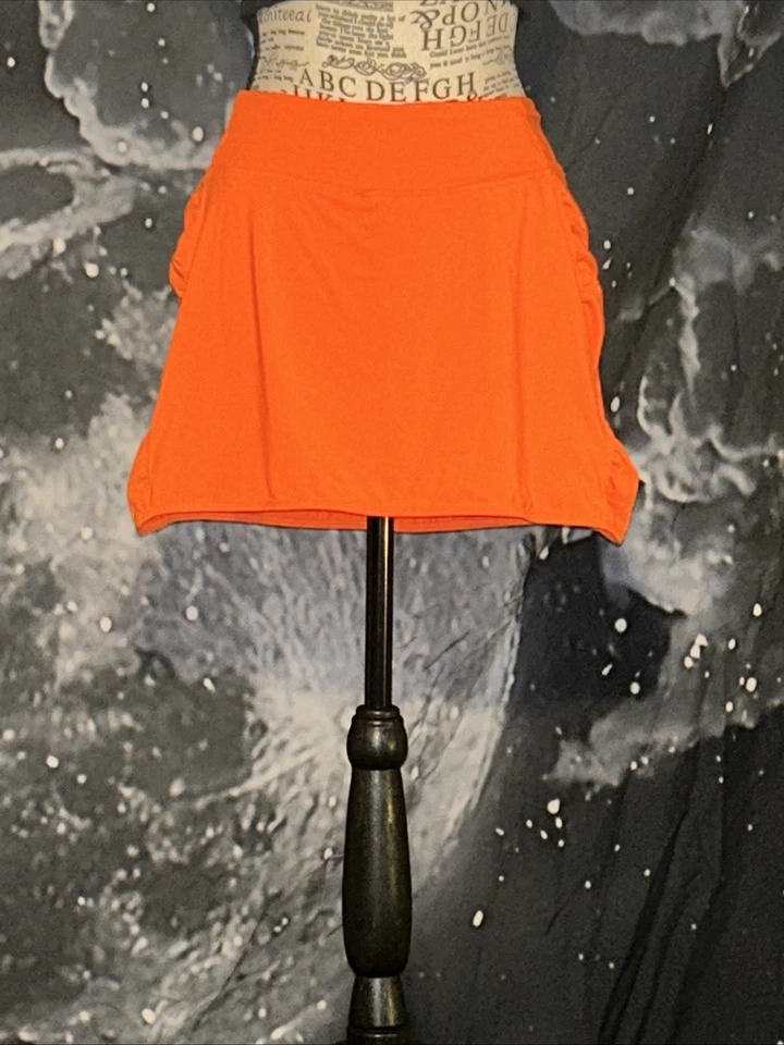 Falda corta de secado rápido de rendimiento de capa 8 Skort pequeño bolsillo oculto Foto 2 de 4