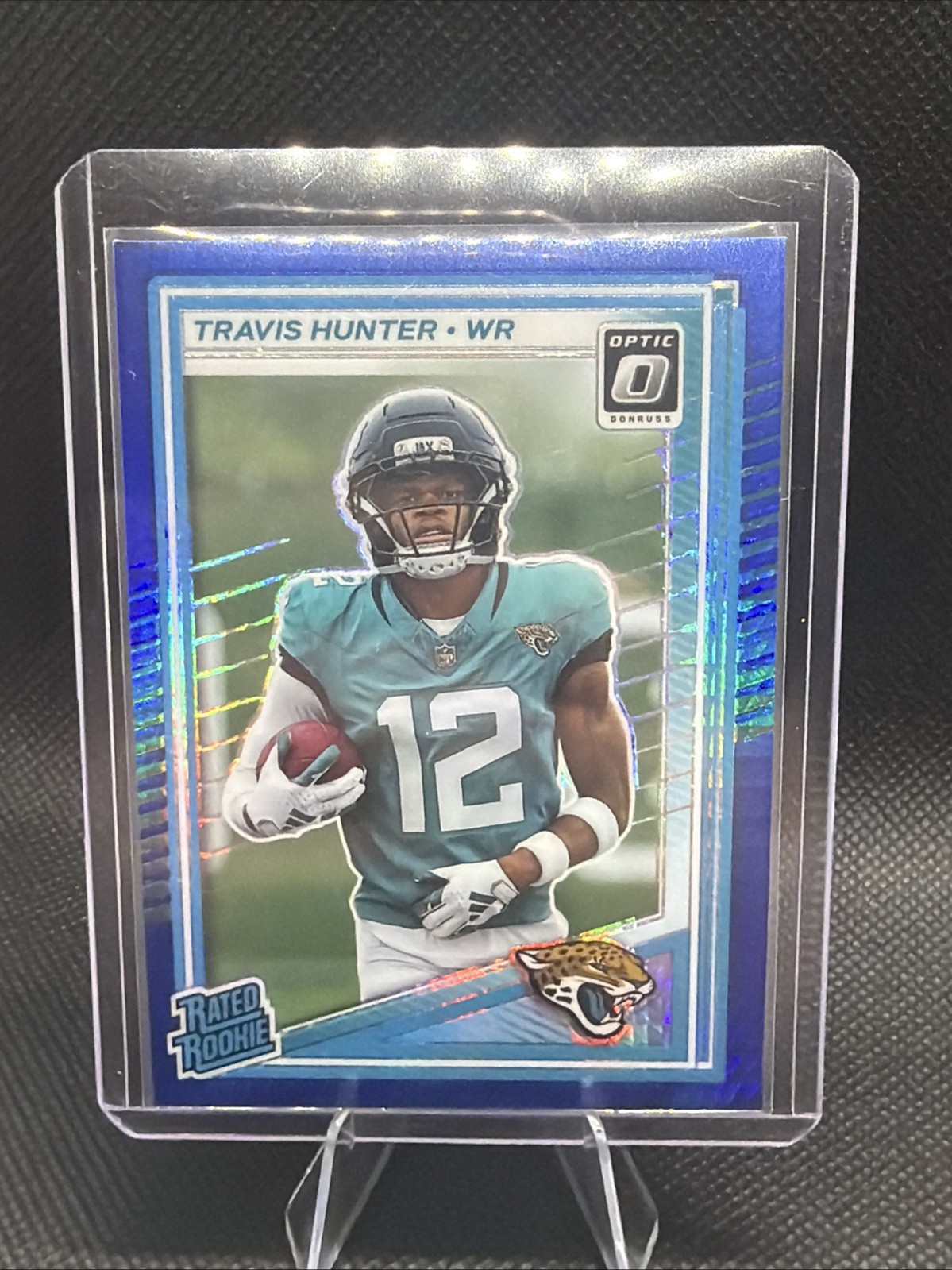 2025 Donruss Optic Travis Hunter Rated Rookie Blue Hyper Prizm #201 RC Jaguars