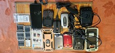 Old Phones And Phone Accessories With Batteries, Connections And Covers