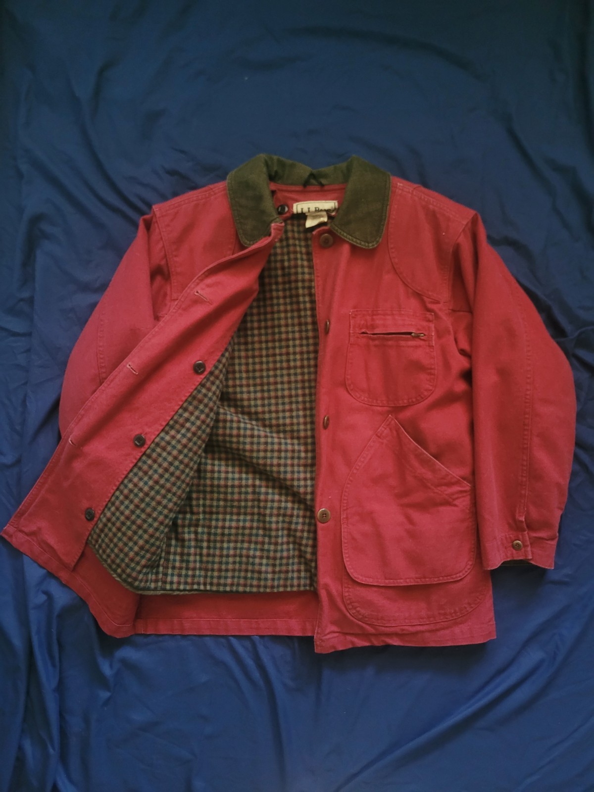 Maroon canvas chore coat with plaid lining and corduroy collar
